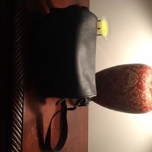 A black shoulder Coach purse
